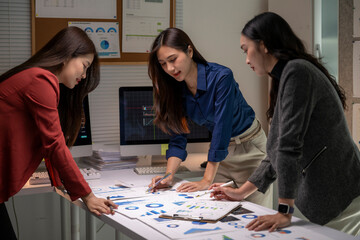 Fototapeta premium Business women collaborating on financial data analysis in office