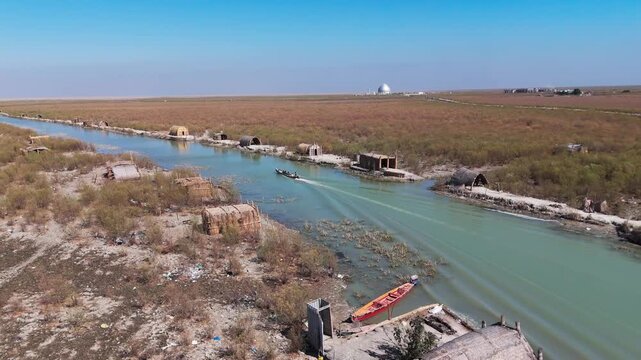 The Al-Jubaysh Marshes, located in Dhi Qar, Iraq, are part of the Mesopotamian marshlands, one of the world's largest wetland ecosystems. Known for their rich biodiversity, these marshes are home to u