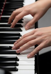 Fototapeta premium Hands delicately performing on a piano keyboard for a musical performance