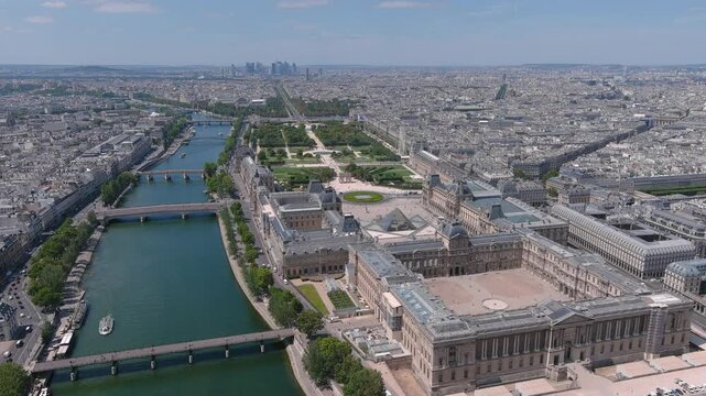 Aerial view of Louvre Museum in Paris, famous art museum in historic centre of city, river Seine - landscape panorama of France, Europe