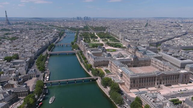 Aerial view of Louvre Museum in Paris, famous art museum in historic centre of city, river Seine - landscape panorama of France, Europe