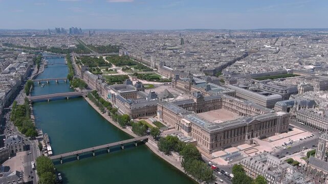 Aerial view of Louvre Museum in Paris, famous art museum in historic centre of city, river Seine - landscape panorama of France, Europe