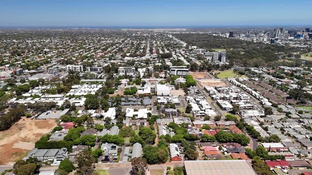 Parkside, Adelaide, South Australia: 4K aerial drone footage of residential suburbs with tree-lined streets, roundabouts, purple jacaranda flowers, houses and urban landscape