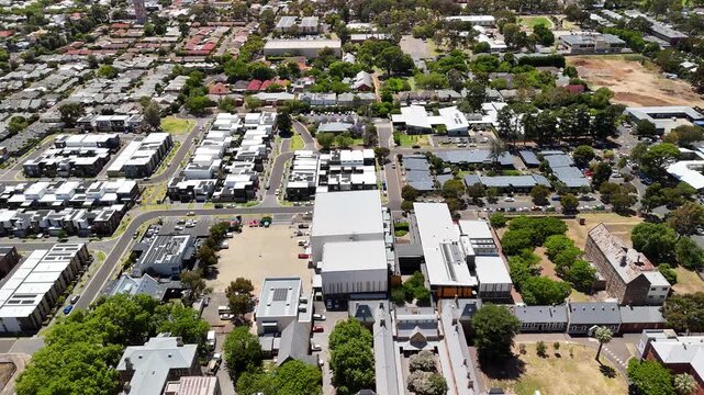 Adelaide, South Australia: 4K aerial drone footage of residential suburbs with tree-lined streets, roundabouts, purple jacaranda flowers, houses and urban landscape in Glenside, Parkside, Dulwich
