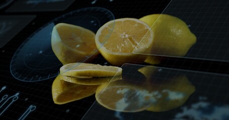 Displaying yellow lemons resting on glossy studio tabletop, with digital HUD overlay and knife © vectorfusionart