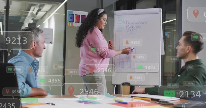 Presenter drawing bars on chart, causing animated bubbles and pins, explaining business data