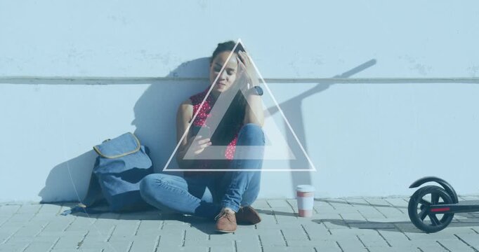 Woman sitting on paved path, scrolling phone and starting pulsing triangle glow for tech demo