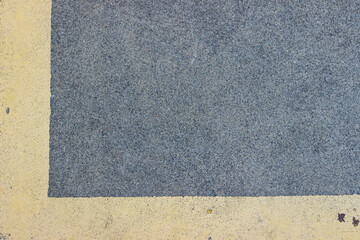 Fototapeta premium Asphalt surface with yellow marking line and textured background creates road backdrop with contrast lines and rough surface