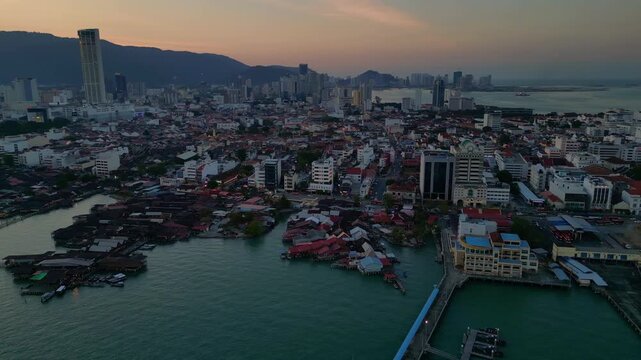 George Town Penang clan jetties cityscape at dusk. Unique aerial view drone