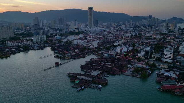 George Town Penang clan jetties cityscape at dusk. Lovely aerial view drone