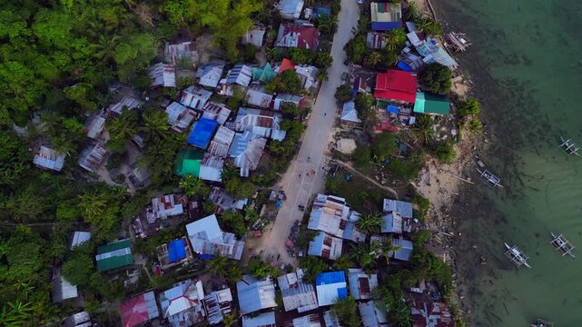 Children playing in street of developing slum village. Perfect aerial view drone