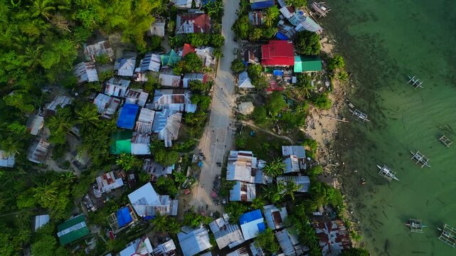 Children playing in street of developing slum village. Nice aerial view drone