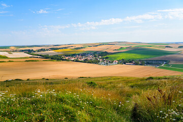 Naklejka premium Panoramic view of the charming village of Escalles surrounded by golden wheat fields on the Opal Coast in Pas-de-Calais, Northern France