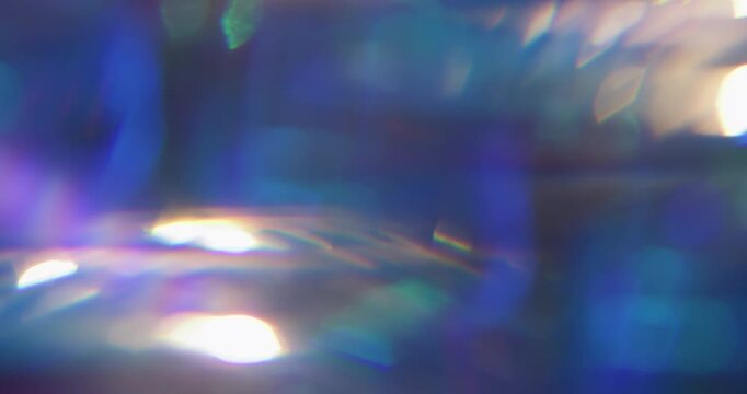Defocused luminosity. Leak lens. Neon color crystal reflection spin texture. Purple blue violet ray fluorescent glow abstract background.