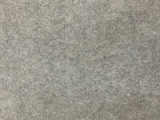 Fototapeta premium Minimalist grey felt texture with soft fiber detail. Uniform industrial fabric surface ideal for interior design, upholstery, and textile backgrounds.
