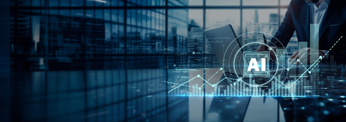 Fototapeta premium Businessman in a modern office with glowing AI icon and rising graph, representing digital transformation, data-driven growth and intelligent business performance.