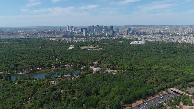 Aerial view of park Bois de Boulogne in Paris, capital city of France in sunny day with blue sky, Europe