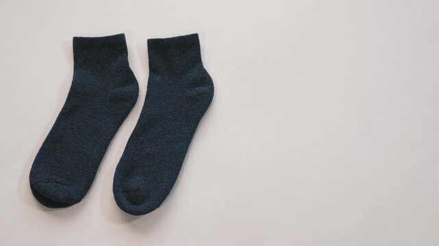 Cozy dark socks on white background home comfort concept conveying warm calm feeling and everyday cozy lifestyle