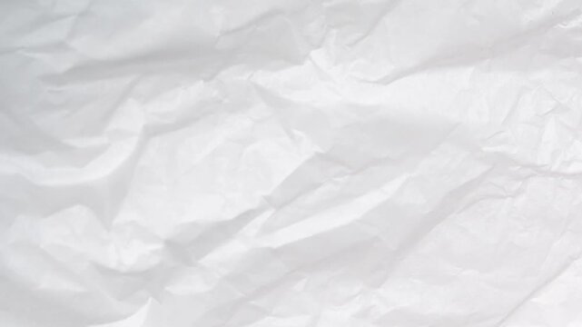 A close-up view of a crumpled white paper texture