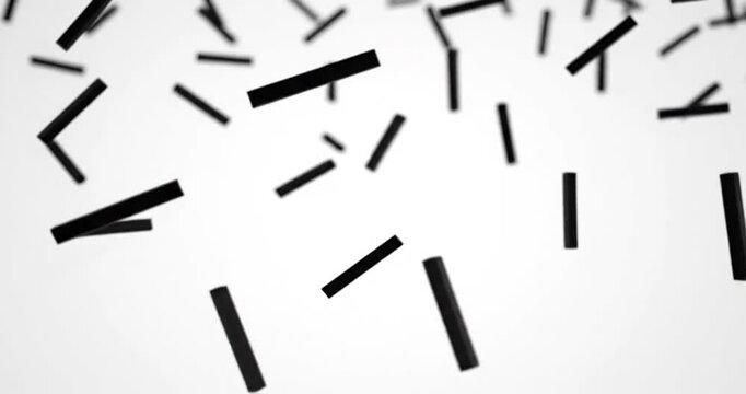 Abstract composition of falling black rectangles on a white background creating dynamic motion