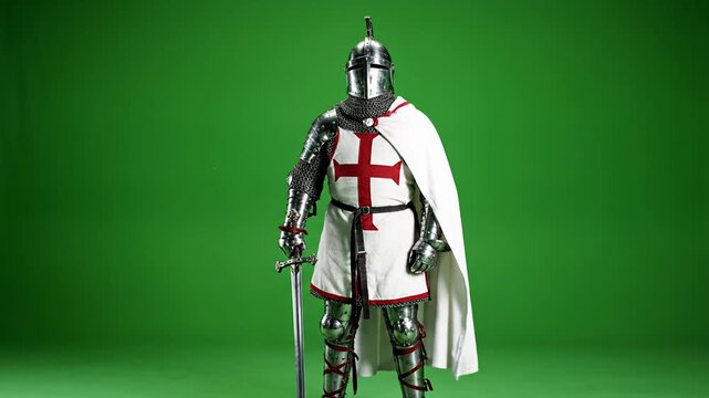 Medieval Knight Templar in Armor Standing with Sword on Green Screen