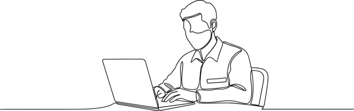 Man wearing mask using laptop computer.