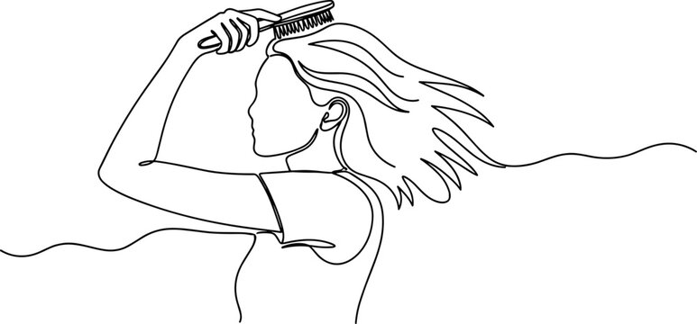 Woman combing her long flowing hair.
