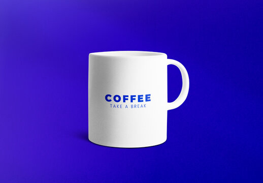 White Mug Mockup On Blue Background PSD