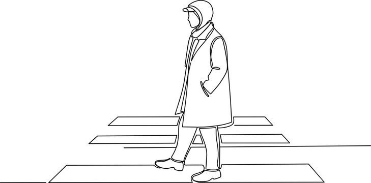 Man walking on a path outdoors.