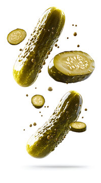 Floating pickles create playful and vibrant scene against white background, showcasing their unique texture and color