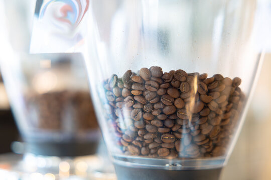 Coffee beans ready to grind, captured with focus and warm tones