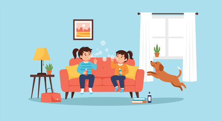 Fototapeta premium Two young sisters sitting on a red sofa and blowing soap bubbles while their pet dog jumps happily in a cozy living room at home.