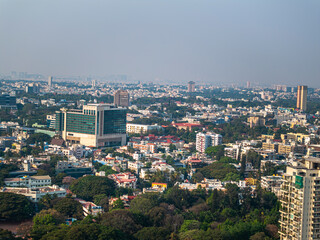 Fototapeta premium Aerial view of the modern high-rise skyscrapers in Bengaluru, Karnataka, showcasing the city's dynamic skyline. Cityscape highlights Bengaluru's blend of urban development and architectural brilliance
