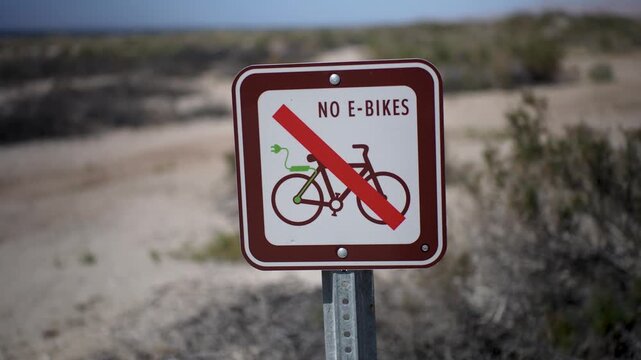 Signs at Salton Sea Recreation Area Campground inform visitors that e-bikes are not permitted in the area.