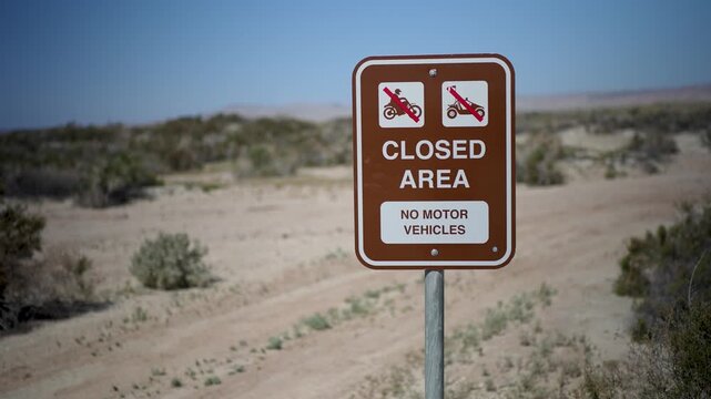 Signs show closed areas at Salton Sea Recreation Area Campground. No motor vehicles allowed in this part of California.