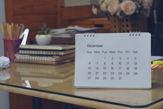 2026 Calendar desk place on business table. Desktop Calender for Planner to plan agenda, timetable, appointment, organization, management each date, month, and year on wooden office table.Calendar Con