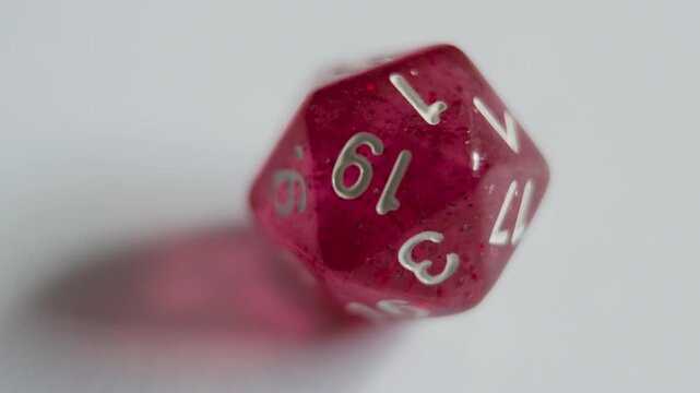 Multiple Rolls of Red D20 Dice on Tabletop Surface