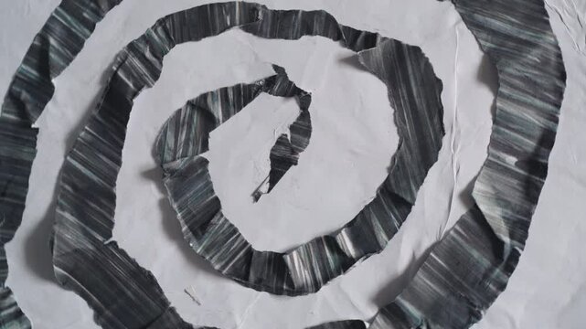 Spinning Abstract Black and White Paper Coiled Shape with Tactile Texture