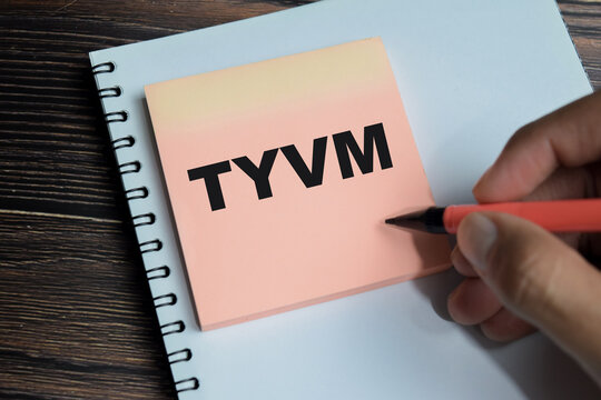 Concept of TYVM - Thank You Very Much write on sticky notes isolated on Wooden Table. Used as a polite expression of gratitude in digital messaging