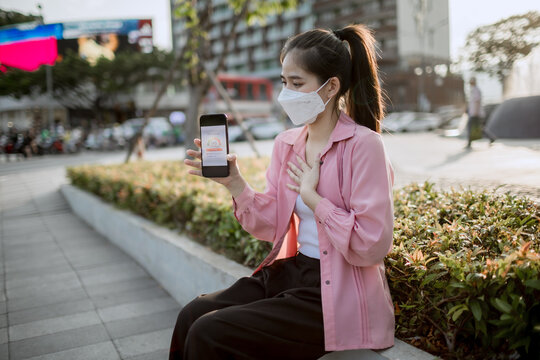 People wearing masks in polluted city air, highlighting smog, respiratory health risks, environmental hazards, poor air quality, and global urban pollution crisis.
