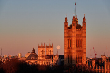Naklejka premium Big Ben and Westminster with Full Moon at Sunset London Landmark Scene