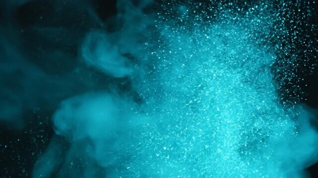 Abstract Blue Smoke Cloud Explosion Against Black Background.