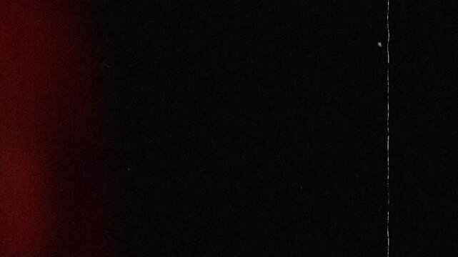 Old Movie Film Texture with Grain, Specks, and Light Leak. 4K Video