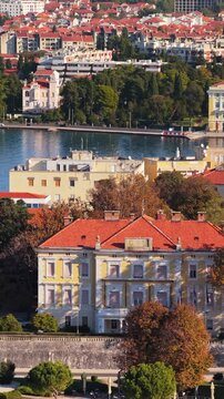 Aerial panoramic view of zadar city old town architecture and adriatic sea coastline during sunset.