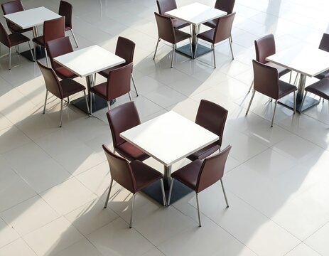 A high-angle view of a modern cafeteria with tables and chairs