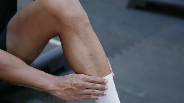 Knee pain relief techniques gym fitness center instructional video indoor environment close-up view health and wellness concept