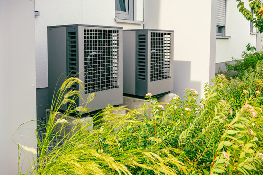 Air source heat pumps installed outside of new and modern city house
