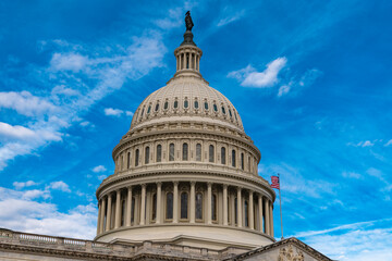 Obraz premium Capitol dome skyline USA clouds sky. Capitol dome American flag patriotism. Capitol dome elections voting legislation. Capitol dome iconic national monument.