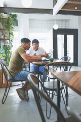 Obraz premium Creative, team and men with laptop in coffee shop, content creation and planning for project on web. Cafe, remote work and people with digital assignment, video editing and collaboration with tech
