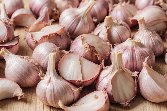 Fresh peeled garlic cloves as background, closeup